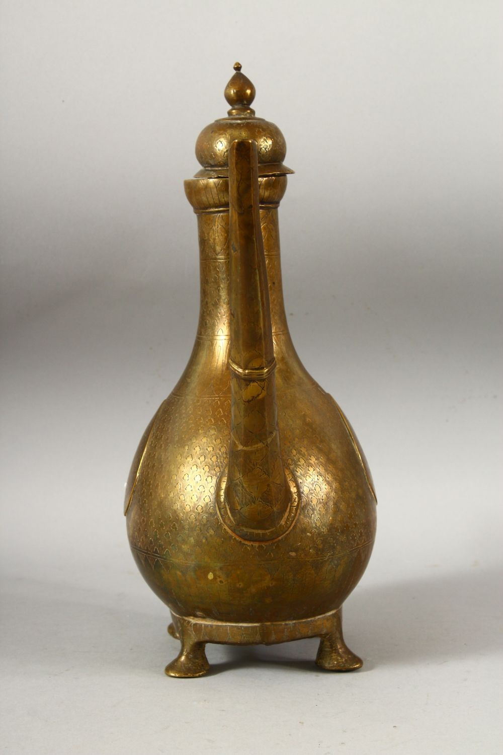 A LARGE 18TH CENTURY MUGHAL INDIAN BRASS EWER, with engraved / chased decoration, 32cm high. - Image 2 of 7