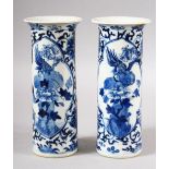 A PAIR OF CHINESE BLUE AND WHITE PORCELAIN SLEEVE VASES, painted with panels depicting a bird