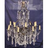 A GOOD LARGE WROUGHT IRON AND CUT GLASS CHANDELIER.