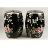 A PAIR OF CHINESE FAMILLE NOIR BARREL SEATS with birds 18ins high.