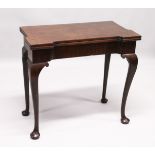 A GEORGE III MAHOGANY FOLD OVER CARD TABLE with a shaped rectangular top, green beize lining with