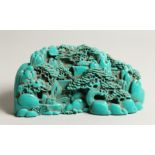 A CHINESE CARVED TURQUOISE BOULDER 9.5ins long.