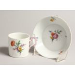 A 19TH CENTURY MEISSEN COFFEE CUP AND SAUCER painted with flowers. Septre mark in blue.