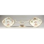 A FINE DANIEL OVAL TWO HANDLED COMPORT painted with flowers, painted by William Pollard and two oval