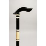A BLACK AND WHITE WALKING STICK 36ins long.