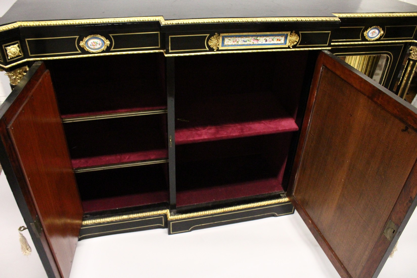 A VERY GOOD 19TH CENTURY FRENCH EBONY BREAK FRONT CREDENZA, with ornate mounts inset with Sevres - Image 6 of 6