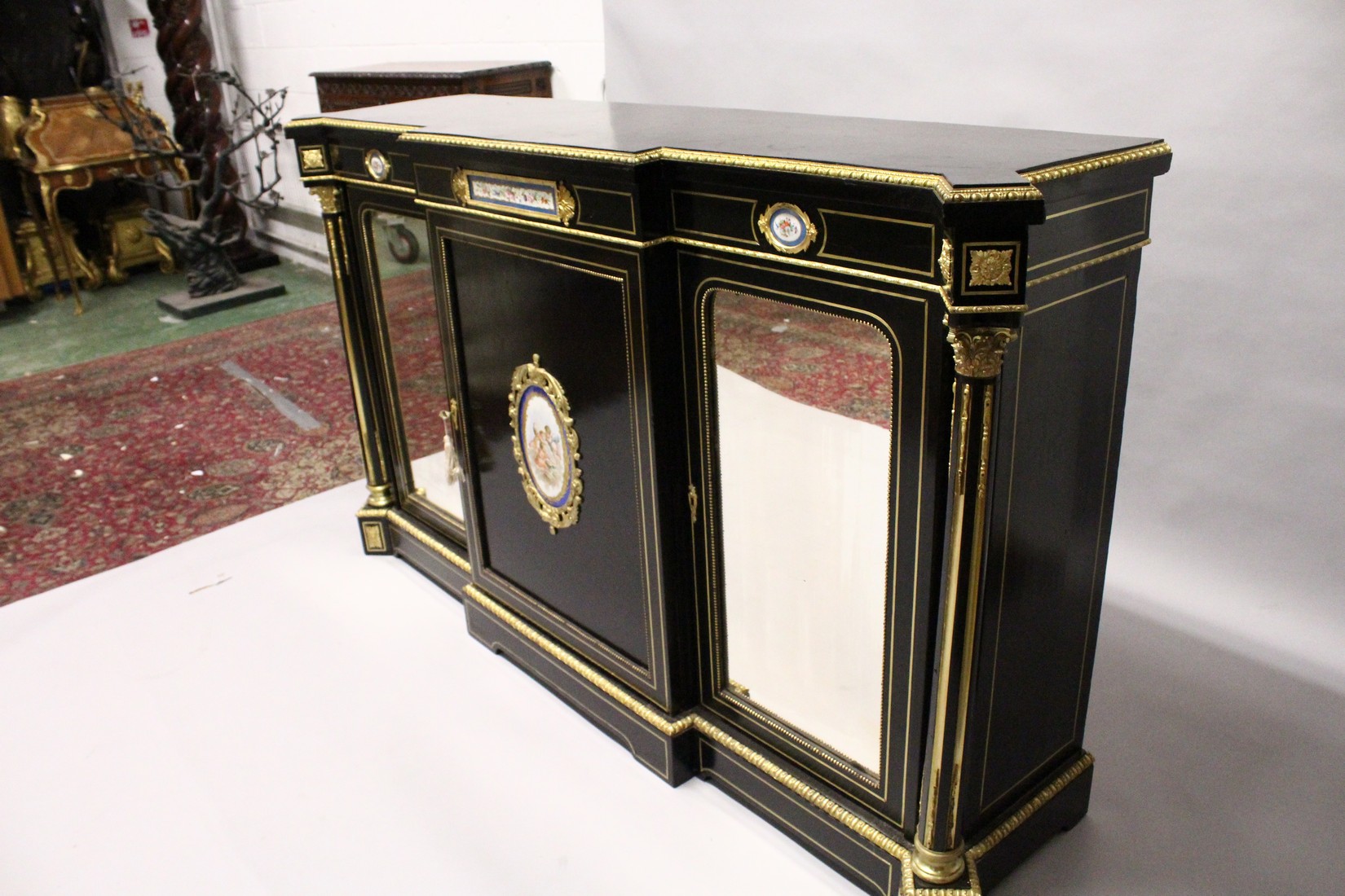 A VERY GOOD 19TH CENTURY FRENCH EBONY BREAK FRONT CREDENZA, with ornate mounts inset with Sevres - Image 4 of 6