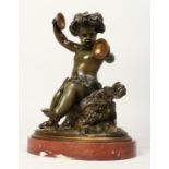 A VERY GOOD BRONZE OF A CHERUB holding cymbals draped in fruiting vines on an oval marble base