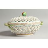 A 19TH CENTURY DRESDEN LATTICE OVAL BASKET AND COVER with fruit and rustic border. 11ins long