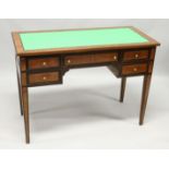 A MAHOGANY AND INLAID WRITING DESK with green leathercloth writing surface over an arrangement of