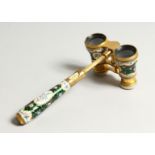 A GOOD PAIR OF 19TH CENTURY FRENCH ORMOLU AND GREEN ENAMEL OPERA GLASSES, with handle, enamel