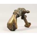 A GOOD CAST BRONZE DOOR KNOCKER, modelled as a hand holding a ball 7ins long