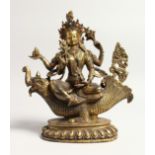 A GILT BRONZE DEITY OF A DRAGON inset with hardstones. 10ins high.