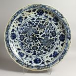 A LARGE CHINESE BLUE AND WHITE CIRCULAR CHARGER with birch and flowers 22ins diameter.