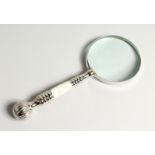 A MAGNIFYING GLASS with a marble and chrome handle.