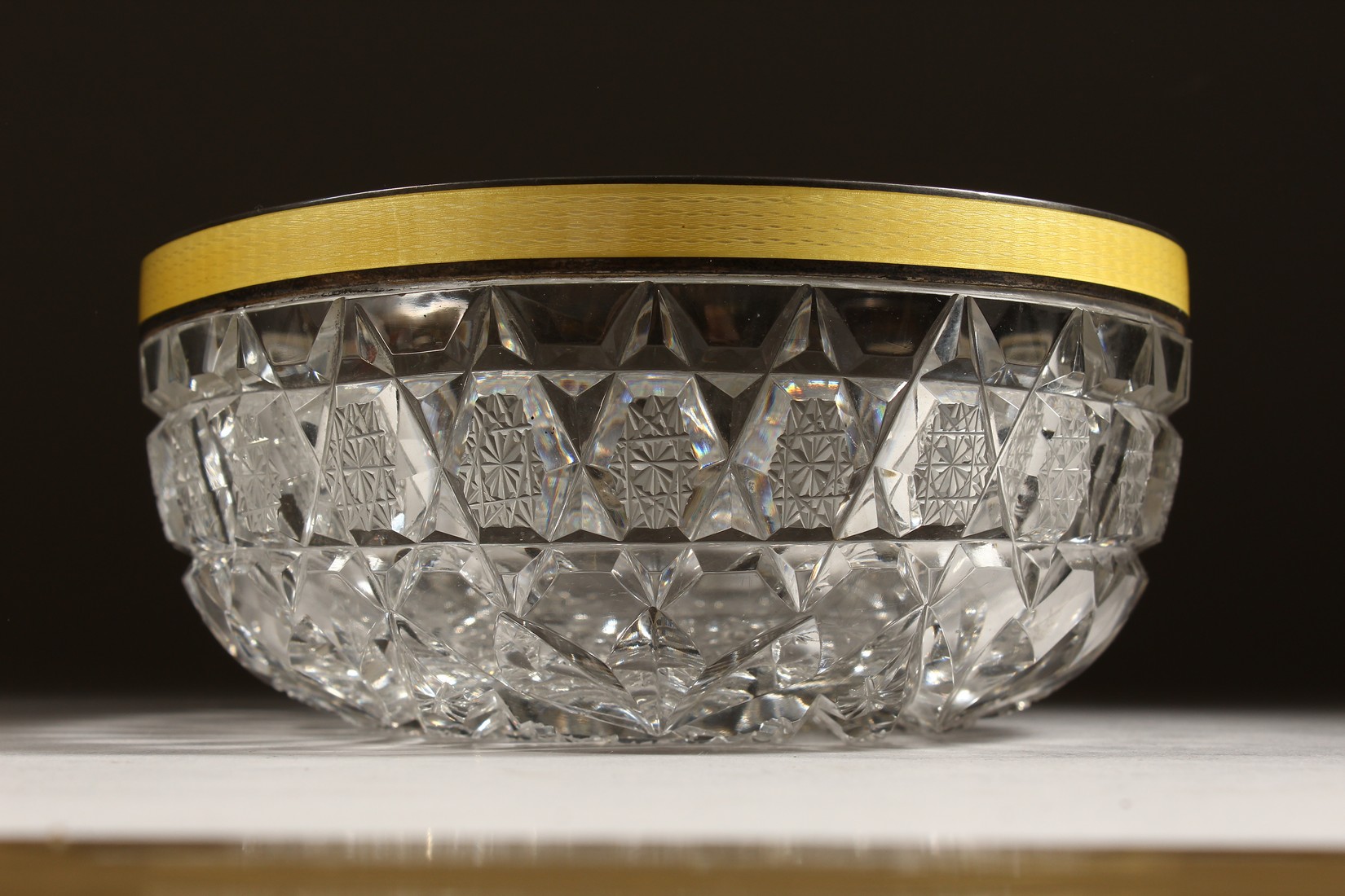 A CUT GLASS CIRCULAR BOWL with silver and yellow enamel rim 6ins diameter. - Image 2 of 8