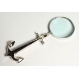 A NOVELTY MAGNIFYING GLASS the handle as an anchor.