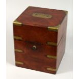 A VICTORIAN MAHOGANY BRASS BOUND DECANTER BOX with fitted interior. 8ins x 10ins