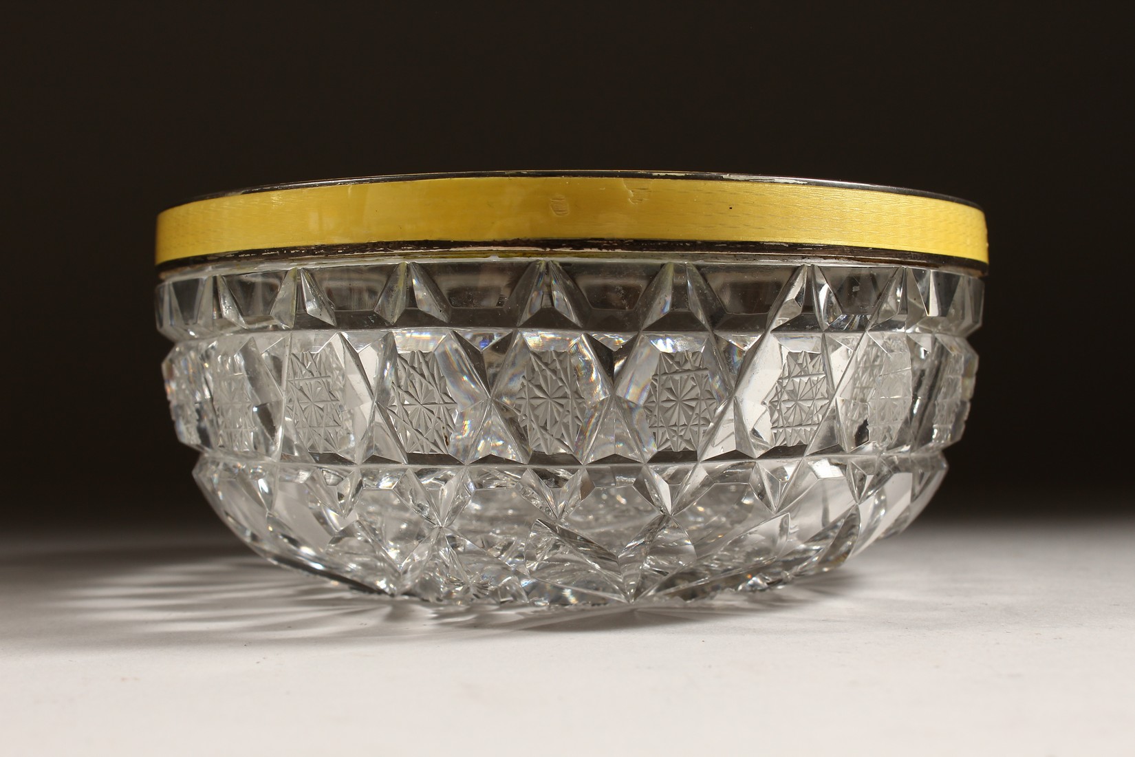 A CUT GLASS CIRCULAR BOWL with silver and yellow enamel rim 6ins diameter. - Image 4 of 8