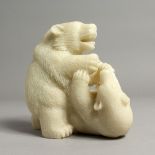 A PAIR OF WHITE CARVED BEARS 6ins high