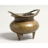 A CHINESE BRONZE TWO HANDLED CENSER with 16 marks. 3.5INS DIAMETER