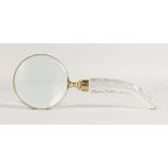 A MAGNIFYING GLASS.