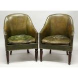 A GOOD PAIR OF LEATHER TUB ARM CHAIRS with brass studs on tapering legs.