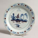 AN 18TH CENTURY ENGLISH BLUE AND WHITE TIN GLAZED CIRCULAR PLATE the side with a Chinese design 8.