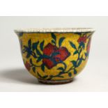 A YELLOW CHINESE PORCELAIN BOWL. 3.25 diameter.