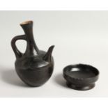 A POTTERY EWER AND BOWL 8.5ins high.