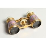 A GOOD SMALL PAIR OF ORMOLU AND LILAC ENAMEL OPERA GLASSES, painted with flowers.