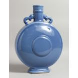 A CHINESE BLUE MOON VASE with two swivel handles six character mark in blue 14ins high.