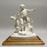 A PARIANWARE GROUP OF PLAYFUL CHILDREN, standing by a tree stump, on a giltwood base. Group 11ins