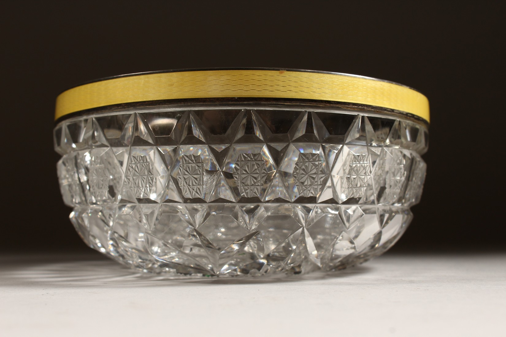 A CUT GLASS CIRCULAR BOWL with silver and yellow enamel rim 6ins diameter. - Image 3 of 8