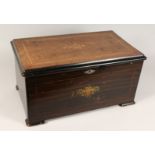 A 19TH CENTURY SWISS MUSICAL BOX playing 10 airs with drums and six bells, in an inlaid rosewood