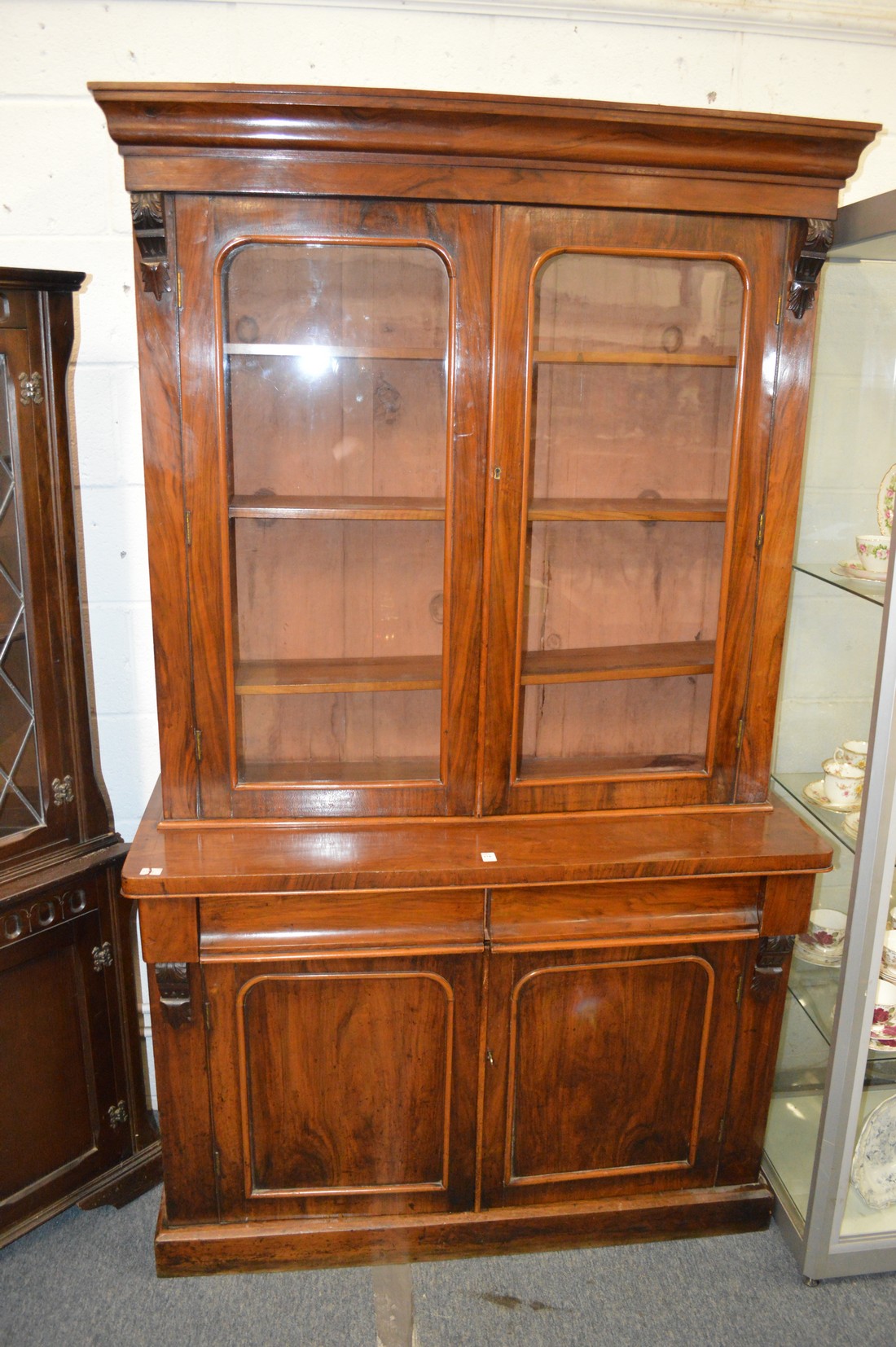 A Victorian walnut cupboard bookcase.