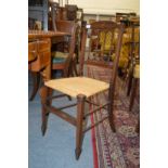 A decoratively inlaid Edwardian occasional chair.