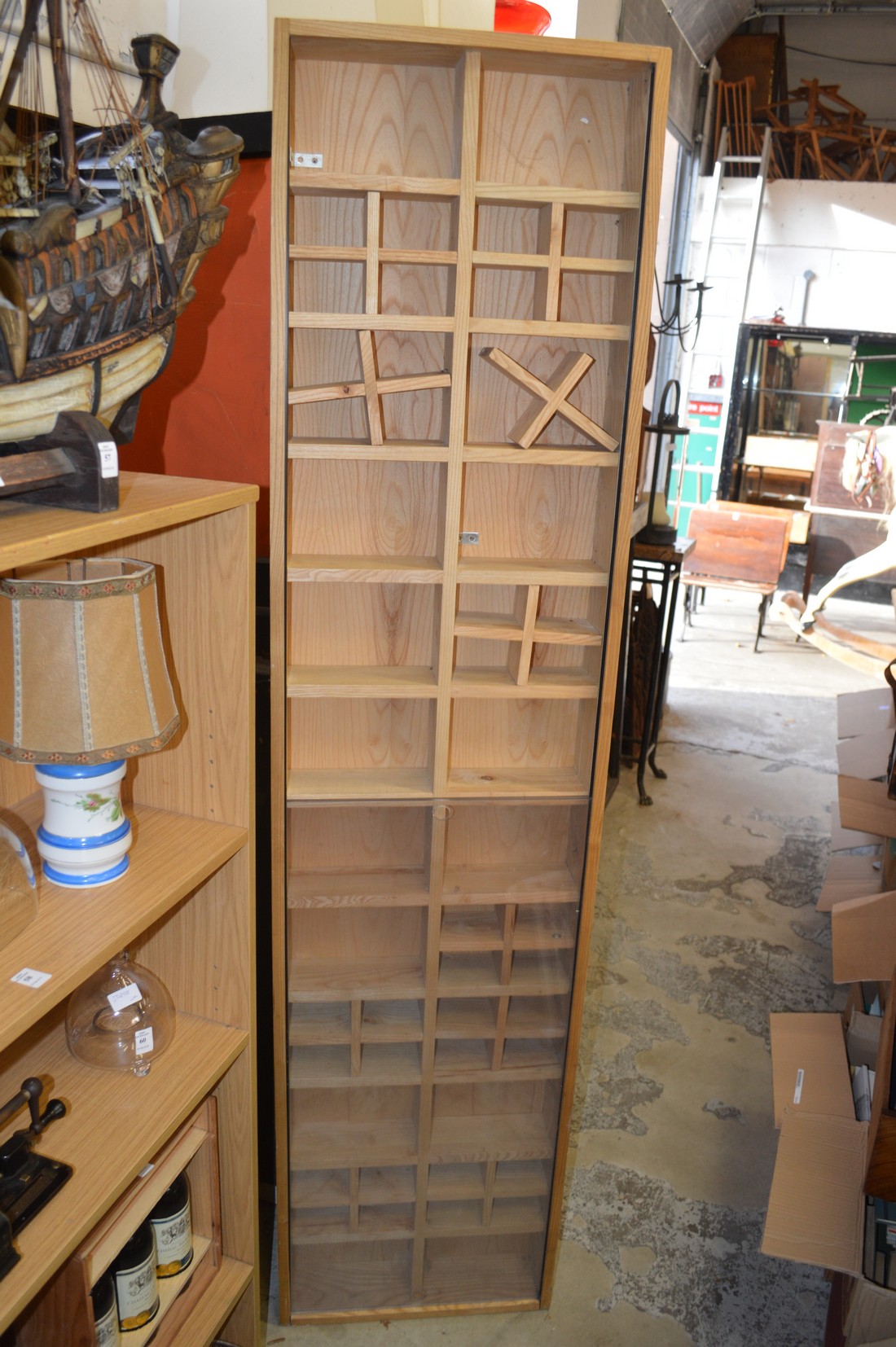 An unusual modern storage unit with sliding perspex doors.