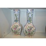 A pair of Chinese Famille Rose square shaped baluster vases.