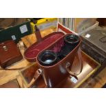A leather cased pair of Carl Zeiss binoculars.