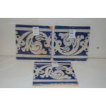 Three Islamic blue and white tiles.