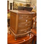 A mahogany three drawer bedside chest.