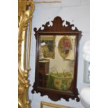 A Georgian style mahogany framed fretwork wall mirror.