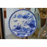 A Chinese blue and white dish painted with a bird.