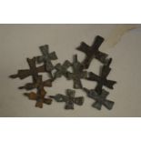 A group of small Roman bronze crosses.
