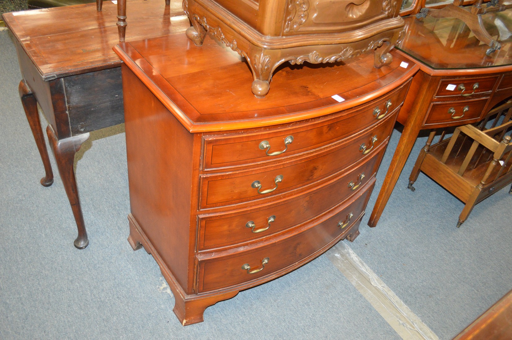 A yew wood bow fronted flour drawer chest.