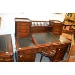 A Victorian mahogany "Dickens" desk.