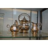 A plated three piece tea service.