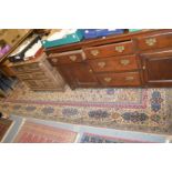 A large beige ground Isfahan style machine made carpet.
