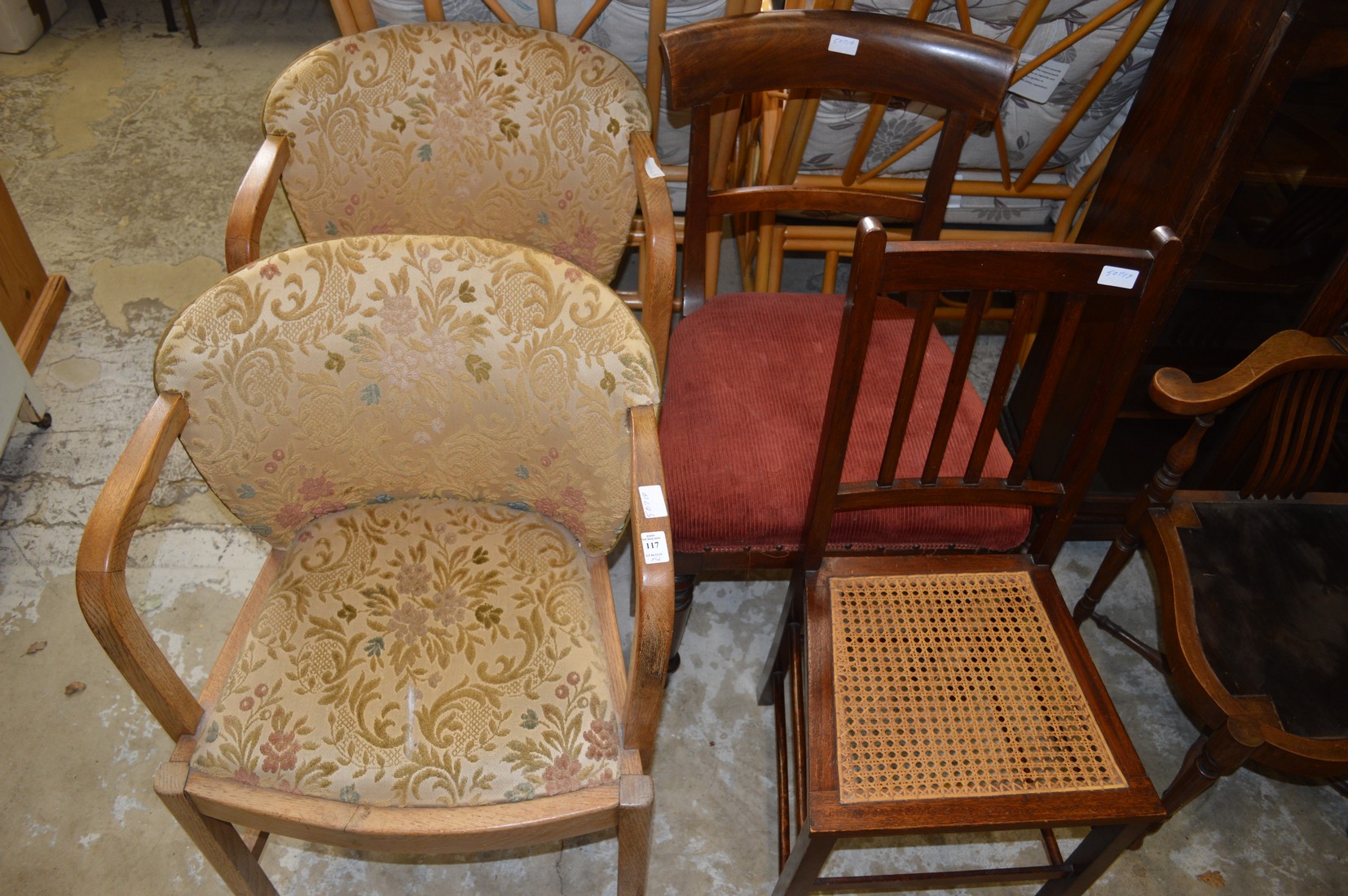 A pair of oak framed armchairs and two other chairs.